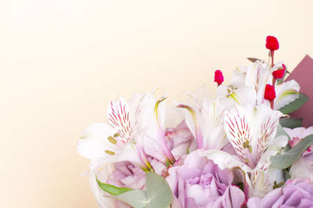 bouquet of Alstroemeria and purple roses. Fresh, lush bouquet of colorful flowersの写真素材