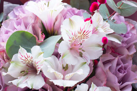 bouquet of Alstroemeria and purple roses. Fresh, lush bouquet of colorful flowersの写真素材