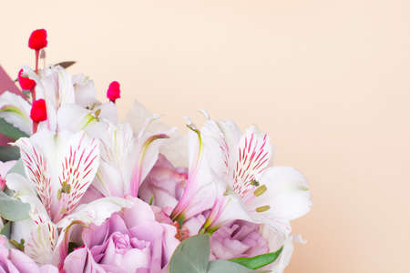 bouquet of Alstroemeria and purple roses. Fresh, lush bouquet of colorful flowersの写真素材