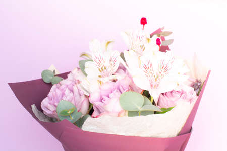 bouquet of Alstroemeria and purple roses. Fresh, lush bouquet of colorful flowersの写真素材