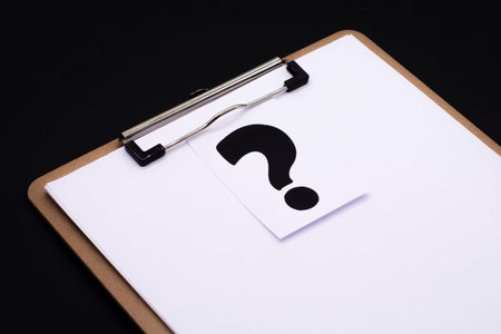 a question mark on a white sheet. FAQ frequency asked questions, Answer and Brainstorming Conceptsの写真素材