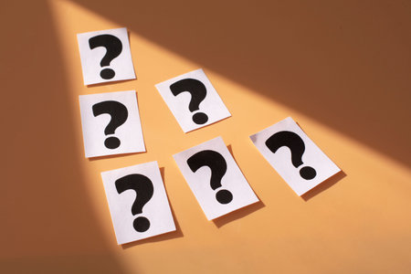 a question mark on a white sheet. FAQ frequency asked questions, Answer and Brainstorming Concepts