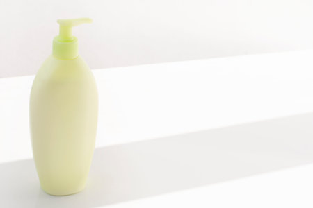Plastic white bottles with dispenser pumps isolated on white background. SPA