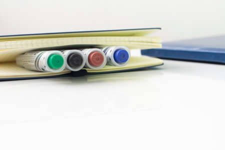 Open multicolored markers closeup on white background. Place for text.の写真素材