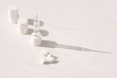 tablets, ampoule on a white background. A vaccine against the virus.の写真素材