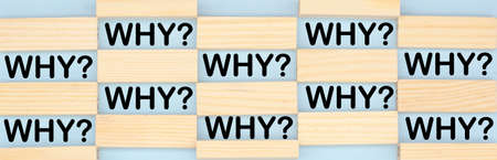 the word why among the wooden blocks. Answer search concept.の写真素材