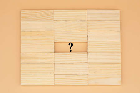 Question mark among the wooden blocks. Answer search concept.の写真素材