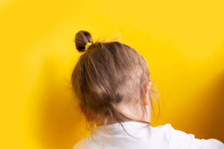 a child's head on a yellow background. Abstract backgroundの写真素材