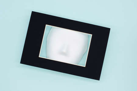 white Venetian mask on a blue background. The concept of the theater. Hypocrisy.の写真素材