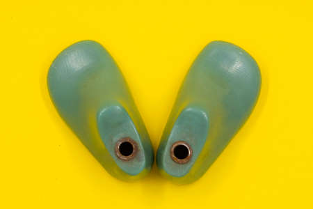 Green form for making children's uniforms on a yellow background. Shoe industryの写真素材