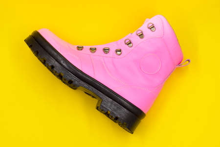 Women's pink shoe on a yellow background. Fashion conceptの写真素材