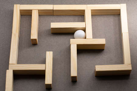 Maze or labyrinth made with white balls in the middle. Business strategy, problem solving, challenge or obstacle concept.の写真素材