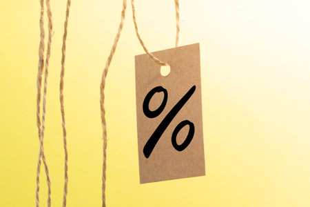a percent sign or icon on isolated yellow background. Business sale or discount concept.