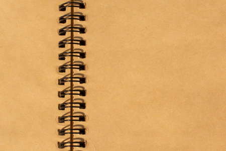 blank brown paper scrap book. close up shot. recycled paper notebook. unfolded ring book.の写真素材