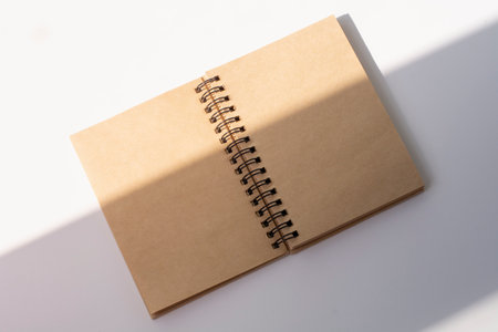 blank brown paper scrap book. close up shot. recycled paper notebook. unfolded ring book.の写真素材