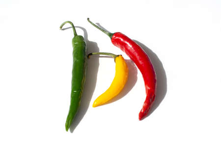 colorful hot chili pepper on a white backgroundの写真素材