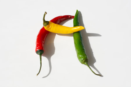 colorful hot chili pepper on a white backgroundの写真素材