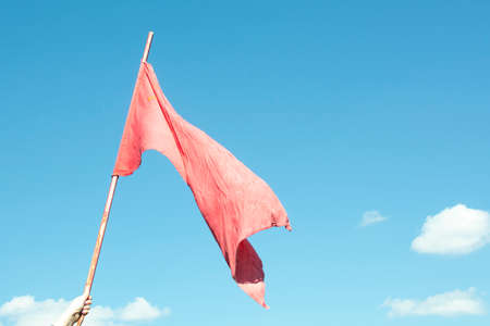 The Union of Soviet Socialist Republics old flag waving on blue backgroundの写真素材