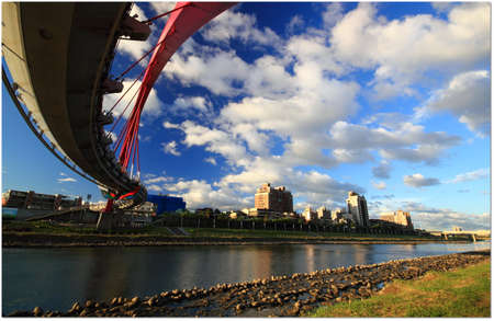 Unusual bridge over the riverの写真素材