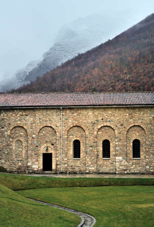 Ancient building in the mountains dusted with light fogの写真素材