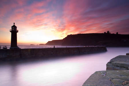 Beautiful pink evening sunset at the lighthouseの写真素材