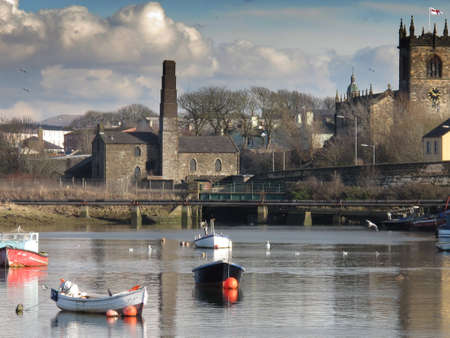 Gloomy clouds approaching a pondの写真素材