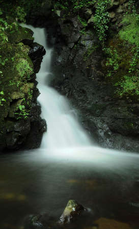 Pictured is a small waterfallの写真素材