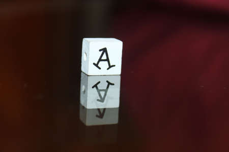 Small wooden cube with the inscriptionの写真素材