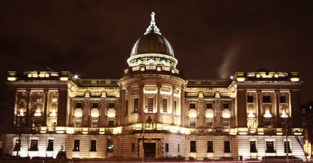 The illumination of the old building illuminates the surroundings
