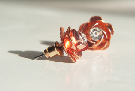 Close-up of rose gold stud earringsの写真素材