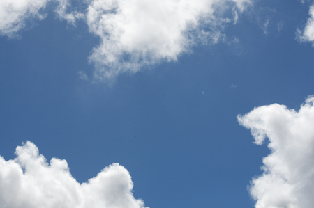 A nice background image with clouds and blue sky, perfect for framing text の写真素材