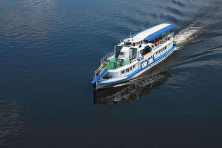 It depicted sailing boat, white with blue stripesの写真素材