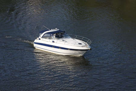 It depicted sailing boat, white with blue stripesの写真素材
