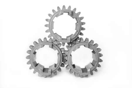 It depicts three gears on white backgroundの写真素材