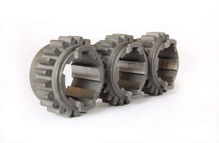 It depicts three gears on white backgroundの写真素材