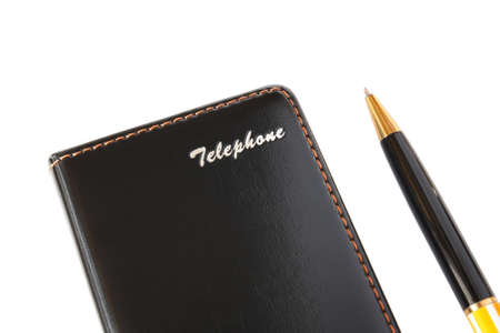 It shows a notebook and pen on a white background の写真素材