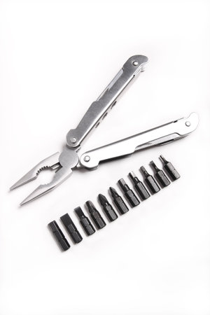 Metal, steel pliers and a screwdriver with a hexagon on a white background 