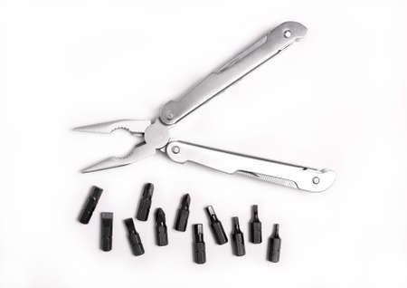 Metal, steel pliers and a screwdriver with a hexagon on a white background の写真素材