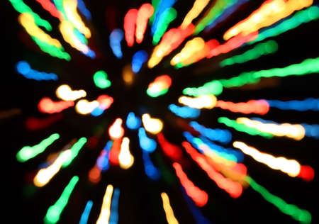 Bands of different colors red blue green yellow orange on a black background の写真素材