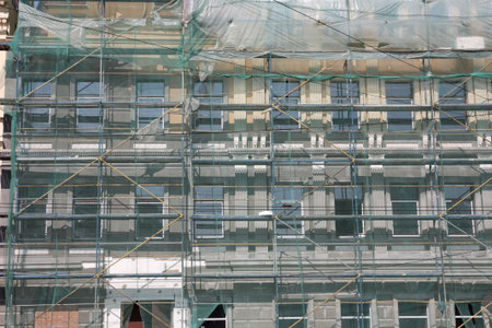 Restoration of old buildings equipped with scaffolds
