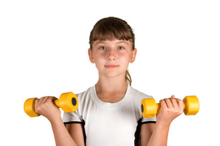 The girl with yellow dumbbells on a white backgroundの写真素材