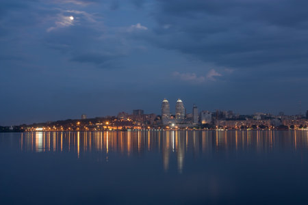 Urban  landscape. The evening city of Dnepropetrovsk on river bank Dnepr