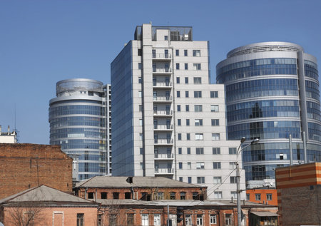 In the foreground is the old brick buildings - the slums behind which a new, modern, high-rise...
