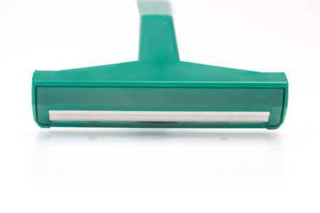 Green manual shaving on a white background