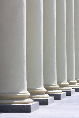 Colonnade. Several columns of sunlit perspective