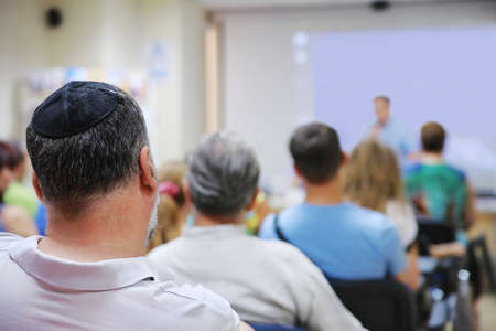 People listen to the speaker on training in the conference roomの写真素材