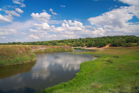 Countryside landscape, river Ingulets, meadow and the sky with cloudsの写真素材