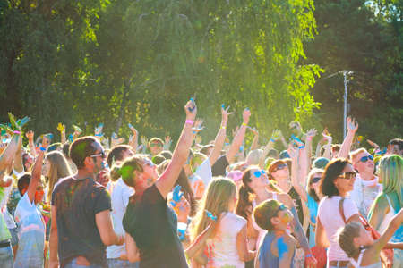 Dnepropetrovsk (Dnepr), Ukraine - August 28, 2016: the crowd with their hands up having fun on the festival of colors "KolirFest"のeditorial素材