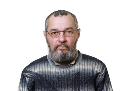 Real man with a beard looks at the camera on white background