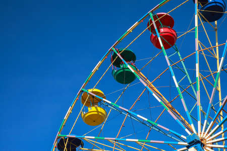 Ferris wheel against the blue skyの写真素材